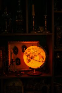 illuminated globe on table in dark